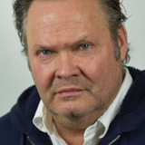 Olan Montgomery — Wayne Enterprises Security (uncredited)