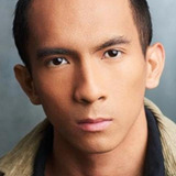 Jon Awit — Business Passenger (uncredited)