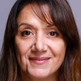 Sherry Stone — CIA Analyst (uncredited)