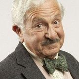 John Bluthal — Professor Pacoli