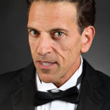 Leon David Franco — Improv Heckler (uncredited)