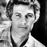 John Gabriel — TV Anchor Reporting Beale's Suicide Threat (uncredited)