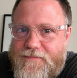 Ted Travelstead — Kamen (voice)