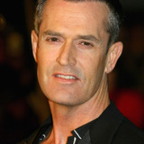 Rupert Everett — Mark Tietjens