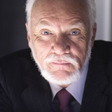 Malcolm McDowell — Stanton Infeld