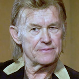 Paul Koslo — Earl Crowther