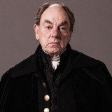 Alun Armstrong — Lord Archibald Benton