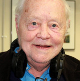 Dudley Sutton — Commissioner Roger Crosse