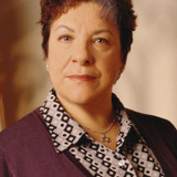 Camille Saviola — Justice Esther Weisenberg