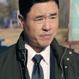 Randall Park — Agent James E. Woo