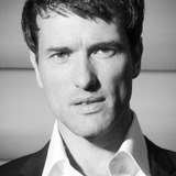 Ed Stoppard — Sir Hallam Holland