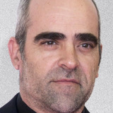 Luis Tosar — Rogelio
